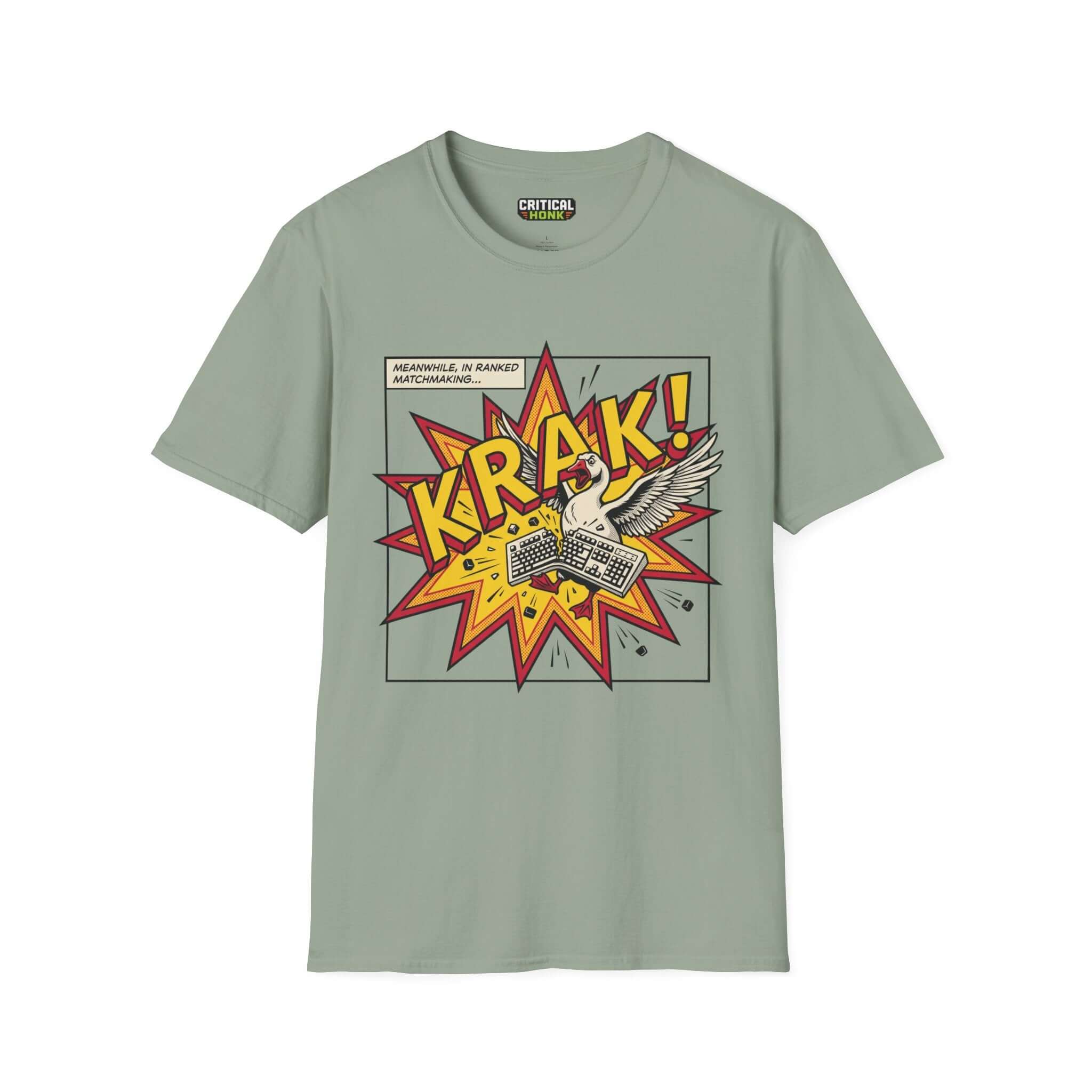 Krak T-Shirt in sage green featuring a comic-style design with a bird and explosive graphics.