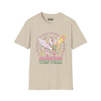 Carriying the team T-Shirt in sand color featuring a whimsical design with a swan and sword, made from 100% cotton.